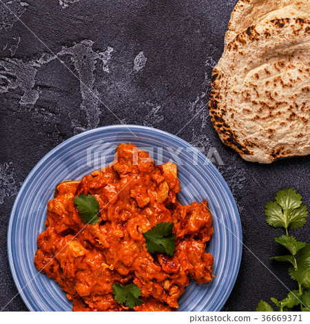 Traditional Indian curry with chicken. Traditional Indian curry with chicken. 36669371