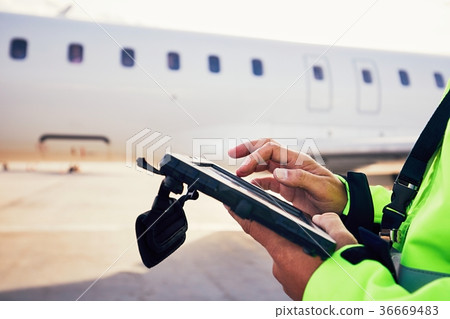 Preparations of passenger airplane at the airport 36669483