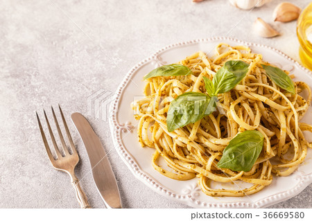 Pasta with homemade pesto sauce. 36669580
