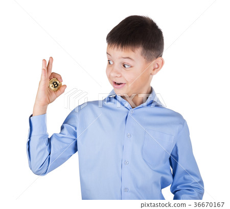 Boy in blue shirt looks with surprise at the 36670167