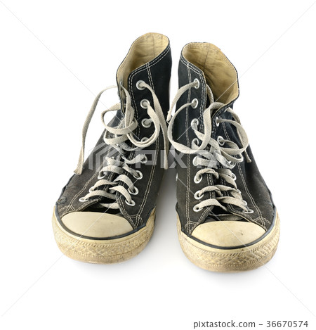 Old worn sneakers isolated on white background. Old worn sneakers isolated on white background. 36670574