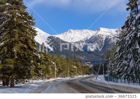 Winter mountain landscape with road and snow Winter mountain landscape with road and snow 36673325
