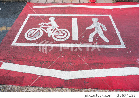 Painted signs on asphalt for pedestrian  36674155