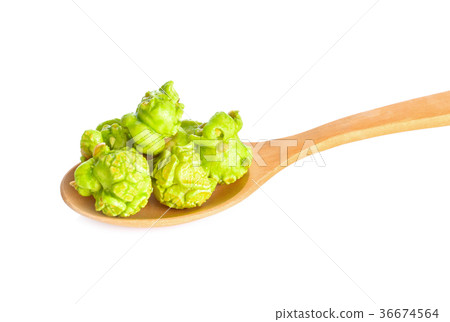 popcorn in wood spoon on white background popcorn in wood spoon on white background 36674564