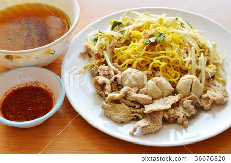Chinese yellow noodle topping pork ball and soup Chinese yellow noodle topping pork ball and soup 36676820