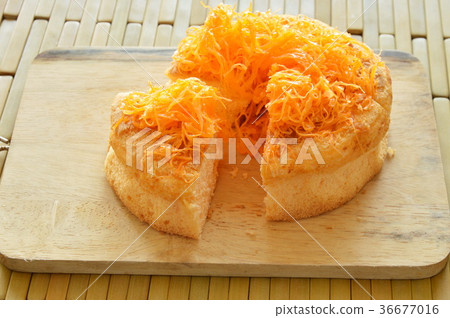 golden egg threads cake cut for piece  36677016