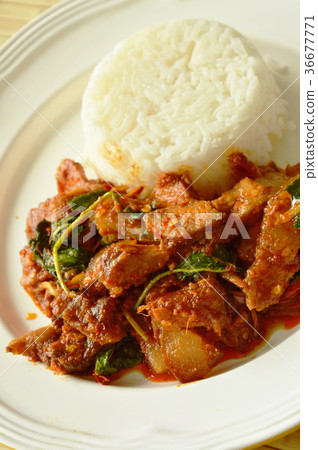 spicy stir fried grilled pork curry with herb spicy stir fried grilled pork curry with herb 36677771
