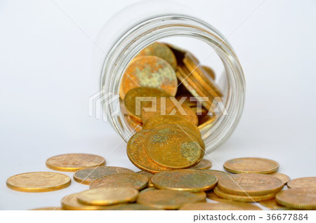 gold coin pour from glass bottle  36677884
