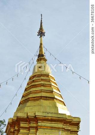 golden pagoda contain Buddha ash  36678108