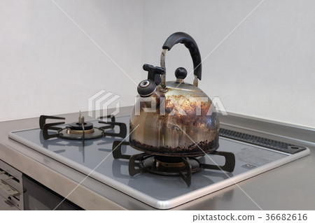 Old kettle on gas stove 36682616