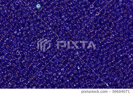 Transparent beads closeup. Blue beads. Transparent beads closeup. Blue beads. 36684071
