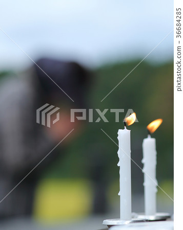 Candle grave visit image 36684285