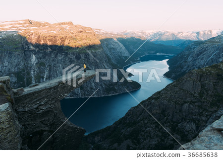 Alone tourist on Trolltunga rock 36685638