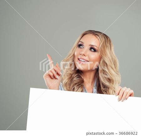 Smiling Woman Pointing her Finger 36686922