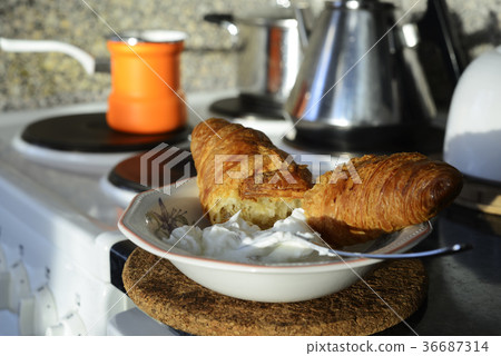 breakfast in the kitchen, coffee and croissants breakfast in the kitchen, coffee and croissants 36687314