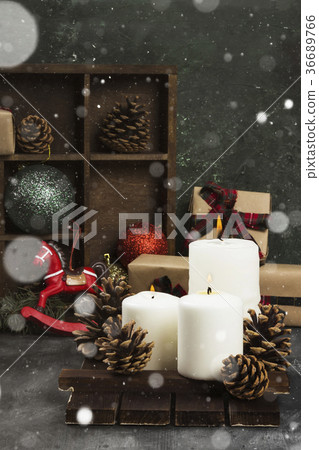 Burning candles and Christmas attributes Burning candles and Christmas attributes 36689766
