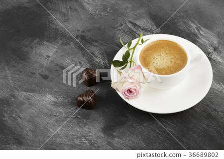Espresso coffee in a white cup, a pink rose Espresso coffee in a white cup, a pink rose 36689802
