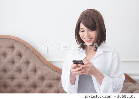 Beautiful girl reading message on smartphone Beautiful girl reading message on smartphone 36693103