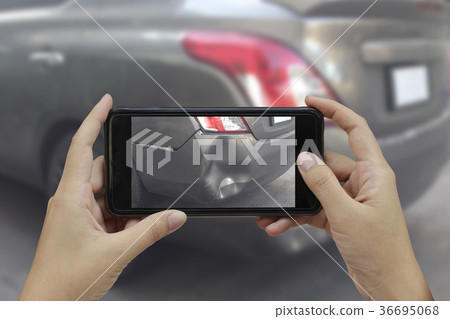 Hand holding smart phone take a photo Hand holding smart phone take a photo 36695068