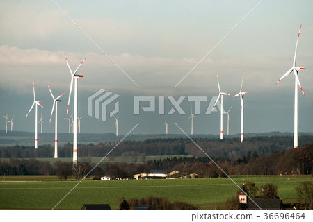 Village in front of panorama view over wind farm 36696464