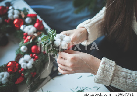 Christmas Decorations and Female Hands Christmas Decorations and Female Hands 36697381