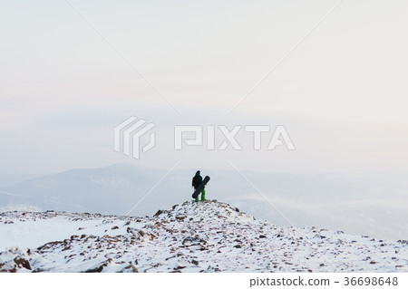man snowboarder in the winter mountains. Sport and man snowboarder in the winter mountains. Sport and 36698648