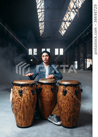 Drummer playing on wooden bongo drums, beat music 36698729
