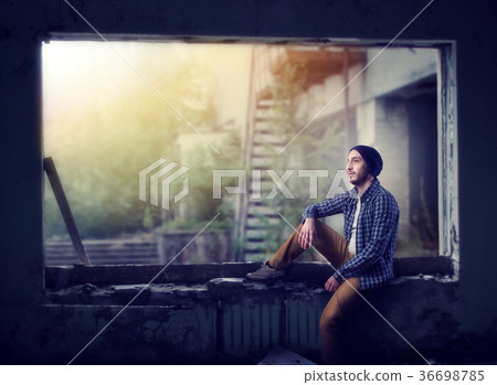 Stalker sitting on the window, abandoned city Stalker sitting on the window, abandoned city 36698785