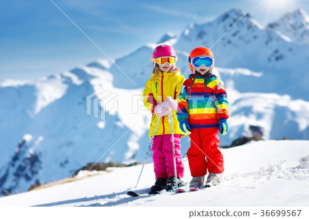 Ski and snow winter fun for kids. Children skiing. Ski and snow winter fun for kids. Children skiing. 36699567