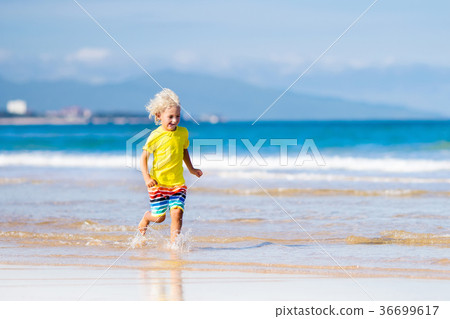 Child on tropical beach. Sea vacation with kids. Child on tropical beach. Sea vacation with kids. 36699617