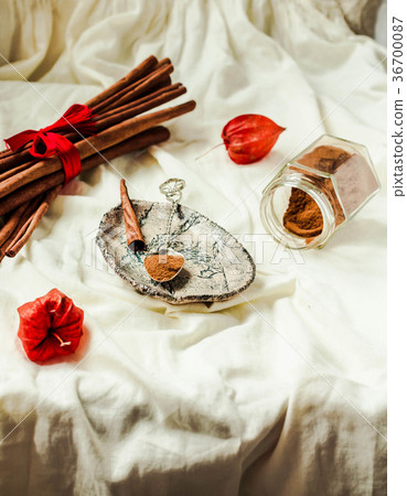 Ceylon real cinnamon, powder in a jar and a stick 36700087