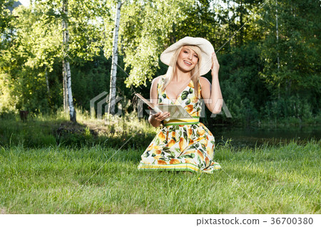 Blond beautiful woman reading book Blond beautiful woman reading book 36700380