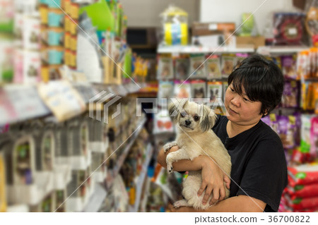 Women and her dog shop at pet shop Women and her dog shop at pet shop 36700822