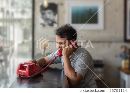 Asian man angry phone call in a coffee shop 36701114