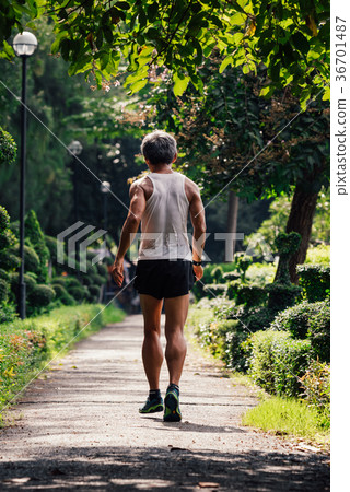 Man jogging run in a outdoor park for exercise Man jogging run in a outdoor park for exercise 36701487