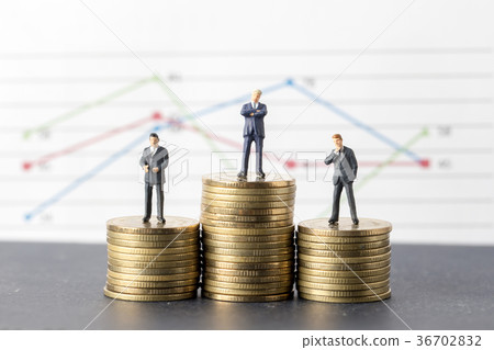 Miniature model group of businessman standing on coin, business Miniature model group of businessman standing on coin, business 36702832