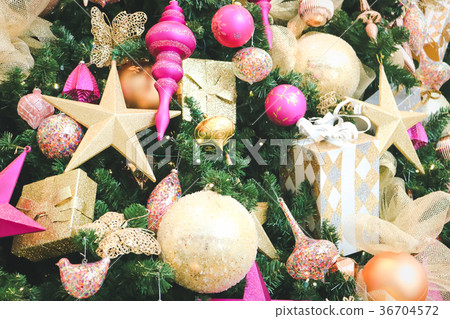 Decorated Christmas tree with gift boxes. 36704572