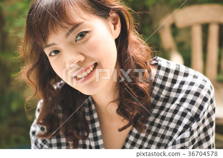Close up of young attractive Asian woman. Close up of young attractive Asian woman. 36704578