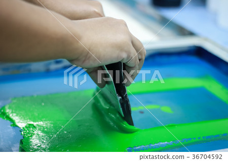 Hand pressing silk-screen printing, close up view. 36704592