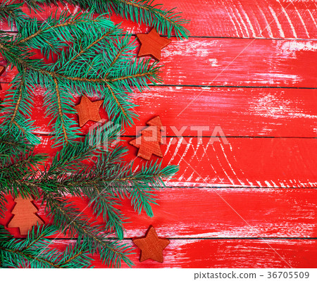 red background of boards with green spruce branch 36705509