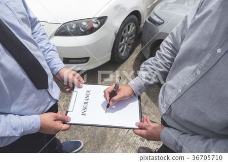 Insurance Agent examine Damaged Car and customer filing signatur Insurance Agent examine Damaged Car and customer filing signatur 36705710