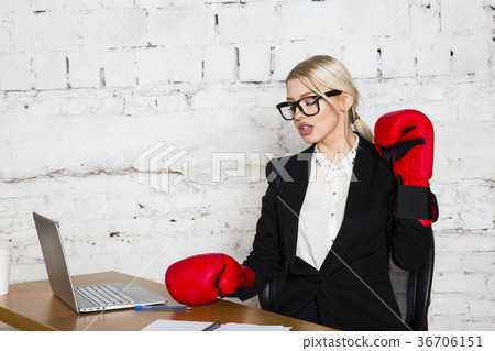 Young blond beauty businesswoman sitting at a 36706151