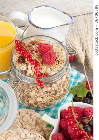 Healthy breakfast with muesli, juice and milk 36706598