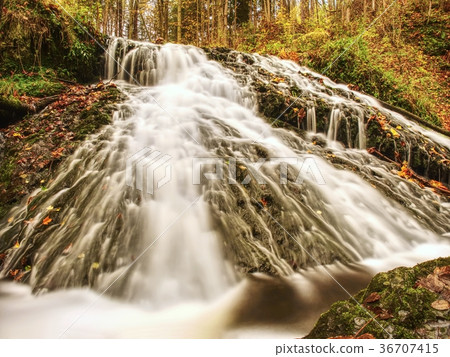 Autumnal waterfall on mountain stream. Foamy  36707415