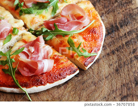 Pizza with smoked ham and rucola Pizza with smoked ham and rucola 36707858
