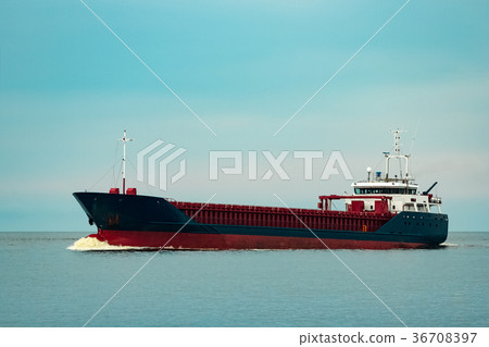 Blue cargo ship underway 36708397