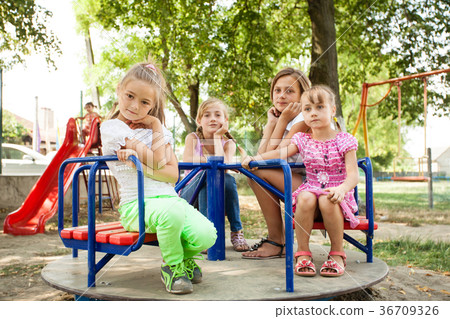 Kids on the carousel  36709326