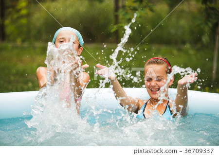 Girls in swimming pool  36709337