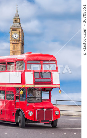 Big Ben with red bus in London, England, UK 36709551