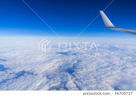 Landscape above the clouds In-flight photography (over Japan) Wing of an airplane 36709727